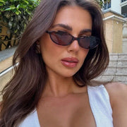 Model wearing the Lola Oval Sunglasses