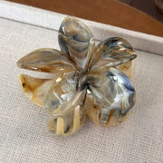 Model wearing the Fleur Marble Hair Claw